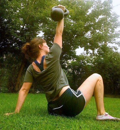 RKC hopeful Natalie showcasing proper TGU form. Note locked out joints and knee-to-hip alignment.