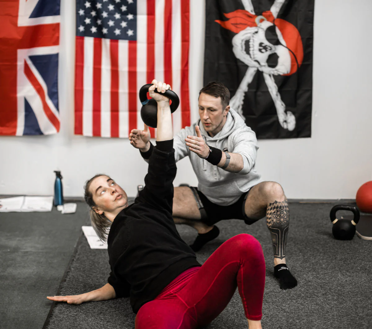 Kettlebell Getup with spotter at an RKC Workshop