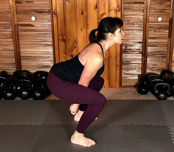 An incorrect squatty kettlebell swing mistake